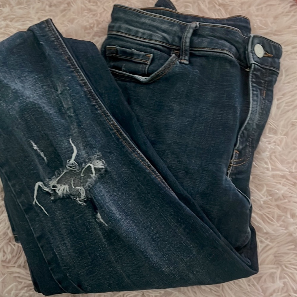 Navy blue jeans with two knee ripes